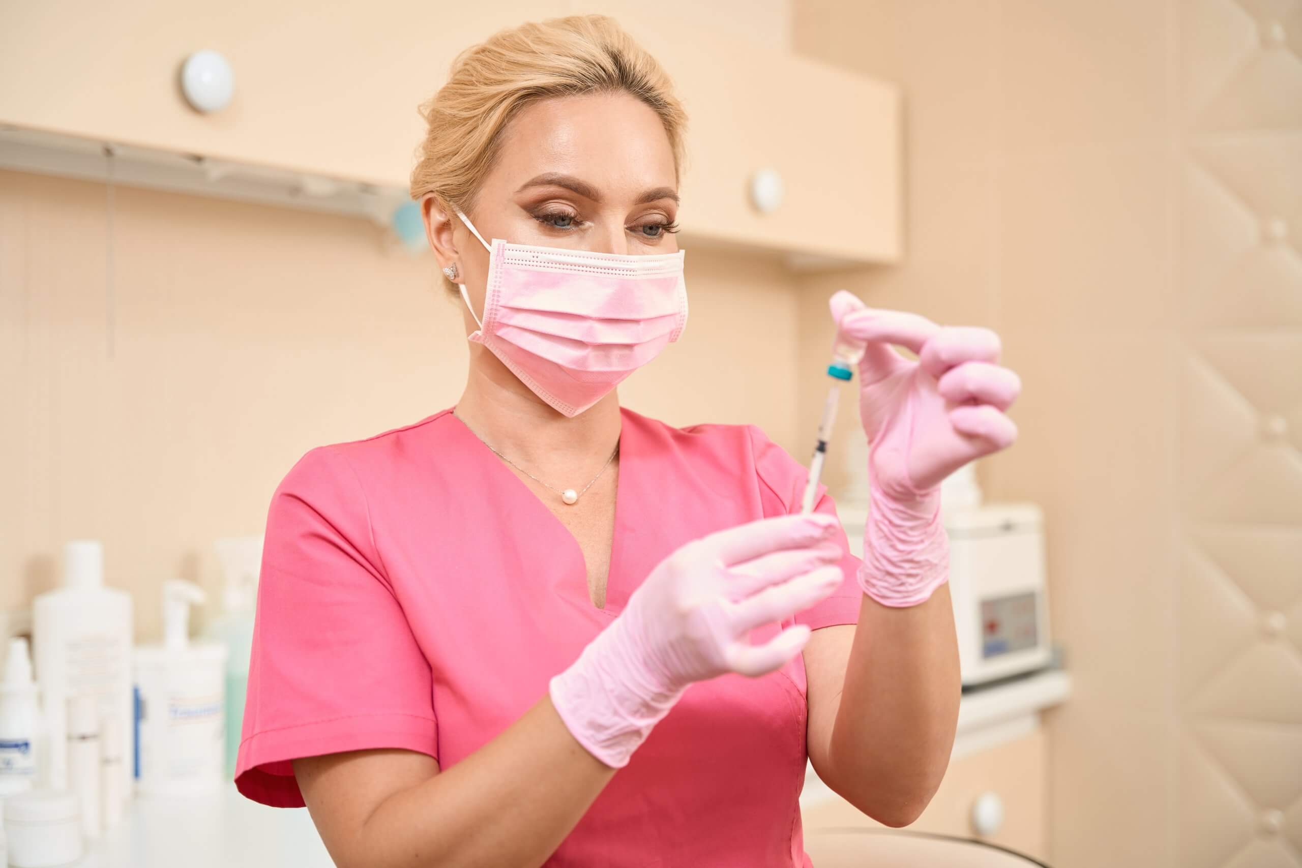 a cosmetic injector using their training to successfully check syringes.